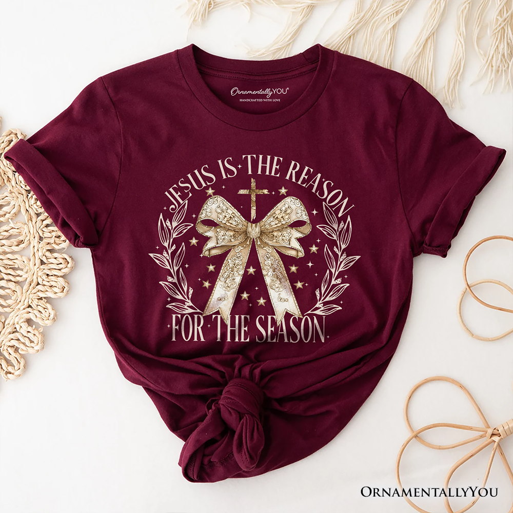 Jesus Is the Reason Christmas T‑Shirt, Coquette Gold Bow Cross Tee for Faithful Women